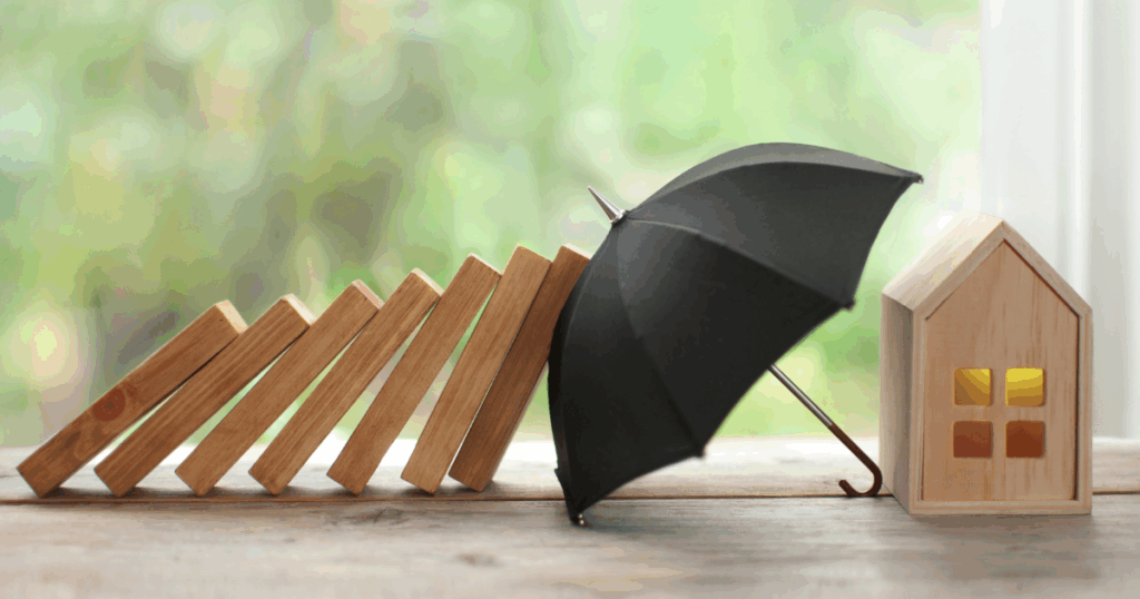 A home being protected by an umbrella, like home insurance